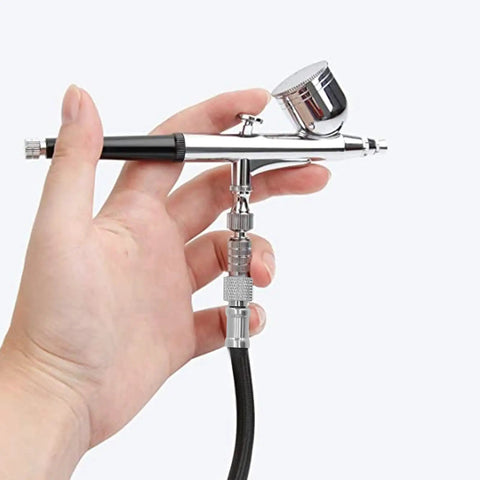 Badass Durable Nylon Airbrush Hose Spanning 1.8 Meters with Universal 1 8 Interface connected to an airbrush for smooth painting.