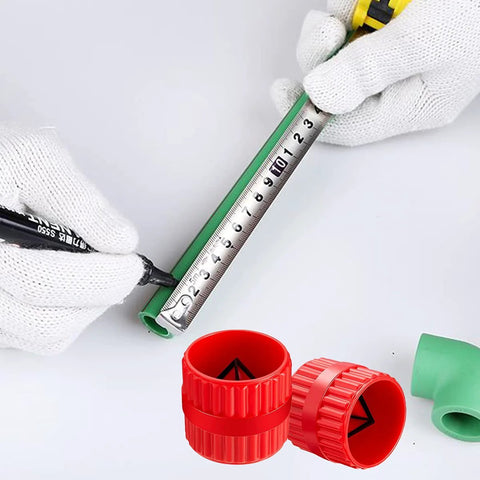 Two red plastic inner-outer pipe deburring reamer caps for PVC tubes; green pipe and measuring tape visible.