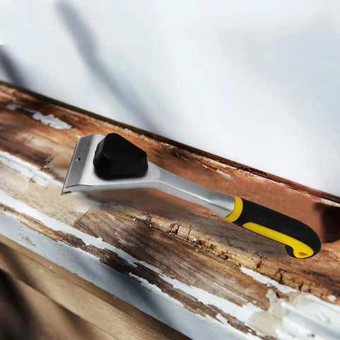 Two Point Five Inch Carbide Razor Blade Paint Remover Scraper on wooden surface, showing ergonomic handle and durable German tungsten blade.