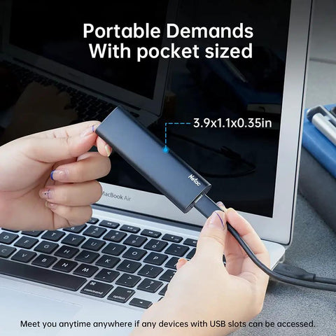Hands holding 250GB Portable SSD USB 3.2 Gen 2 Type-C External Drive, Slim Aluminum, next to laptop, showing size and portability.