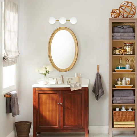 Three Light Vanity Light Fixtures In Gold Brass Finish with dimmable wall sconce above bathroom mirror