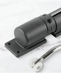 Close-up of Built Tough Adjustable Zinc Alloy Door Closer with black hinge and spring mechanism.