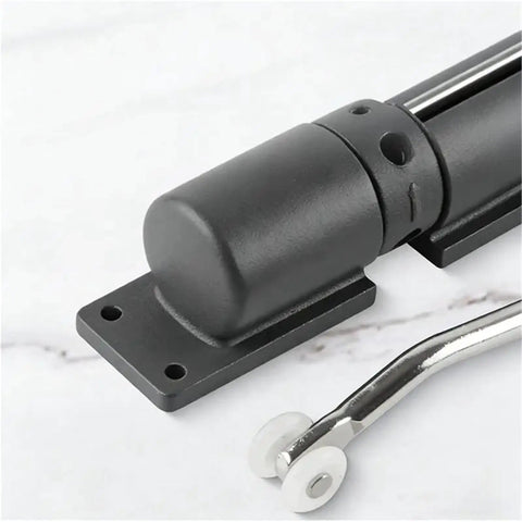 Close-up of Built Tough Adjustable Zinc Alloy Door Closer with black hinge and spring mechanism.