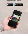 Hand holding smartphone displaying footage from 4K PoE Security Camera With AI Human And Vehicle Detection, outdoor view of a driveway.