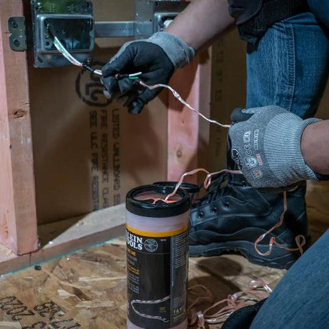 No Nonsense Heavy Duty Steel Fish Tape Wire Pulling Kit With 50 Foot Tape 500 Foot Pull Line And All Purpose Lubricant in use