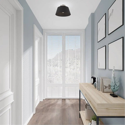 One Light Brushed Nickel Ceiling Mount Fixture With Black Accents, shown in a modern hallway with wood decor, bulbs not included.