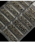 Overview of compartments filled with tiny screws in the Super Slick Micro Screw Kit For Eyeglasses And Watches.