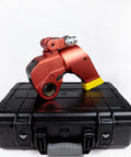 Pro Grade Hydraulic Torque Wrench With Beefed Up Square Drive And Corrosion Proof Alloy Build, red color, resting on a black case.