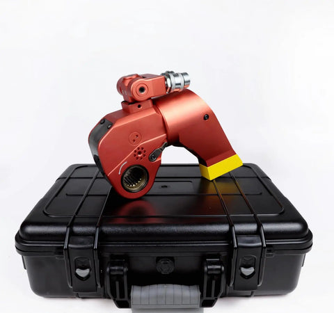 Pro Grade Hydraulic Torque Wrench With Beefed Up Square Drive And Corrosion Proof Alloy Build, red color, resting on a black case.