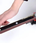 Heavy Duty Angle Grinder Belt Sander Attachment Portable Sanding Adapter With Stable Alloy Bracket For Woodworking Precision Grinding and Finishing Projects Easy To Use Tool Accessory with hand holding the attachment