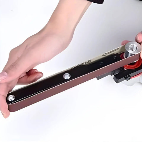 Heavy Duty Angle Grinder Belt Sander Attachment Portable Sanding Adapter With Stable Alloy Bracket For Woodworking Precision Grinding and Finishing Projects Easy To Use Tool Accessory with hand holding the attachment