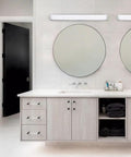 Metro 37In LED Energy Star Bathroom Vanity And Wall Light 3000K Brushed Nickel mounted above mirrors in modern bathroom.