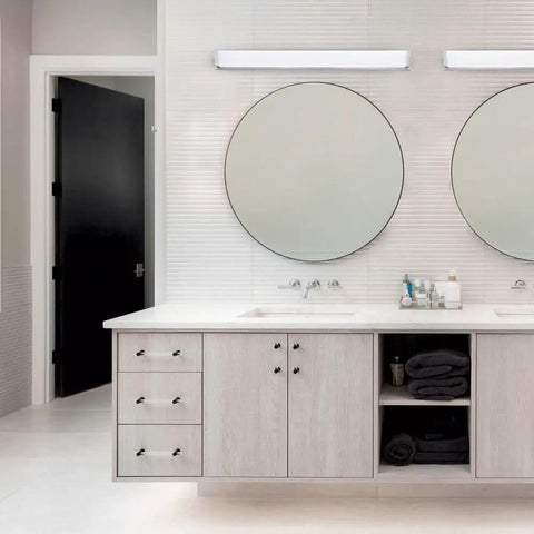 Metro 37In LED Energy Star Bathroom Vanity And Wall Light 3000K Brushed Nickel mounted above mirrors in modern bathroom.