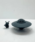 Alien UFO Airship Figurine 3D Print Kit For Miniature Dioramas And Collectibles With High Detail Texture And Easy Assembly Dope For Tabletop Gaming And Craft Projects showing a gray UFO model and alien figurine on display.