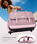 Woman holding a pink rolling laptop bag for women with dual lock and wheels 16 inch computer briefcase TSA friendly locks.