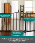 Extra Wide Windsor Arch Walk-Through Pet Gate 38.3 To 72 Inches Wide, 30 Inches Tall, Hardware Mounted, Matte Bronze in hallway