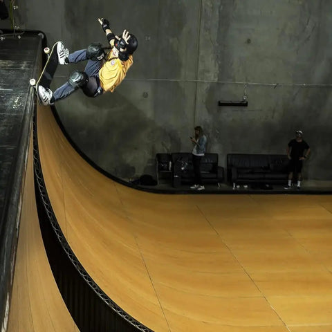 Child skateboarder wearing Six Pack Skateboard Pad Set For Juniors With Knee Elbow And Wrist Guards Contoured Fit performing on ramp