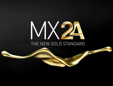 MX2A logo with golden splash graphic on a dark background, representing the new gold standard in mechanical switches.