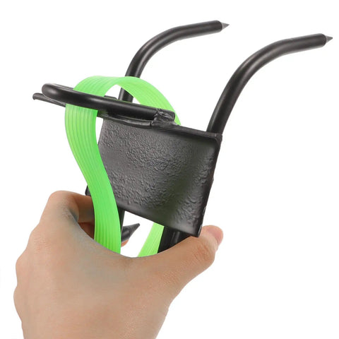Hand holding Pro Grade Tree Climbing Gear With Steel Gaffs And Non Slip Ankle Buckles For Arborists And Outdoor Adventurers Steady Ascent Spikes For Trimming Fruit Picking Hunting Rock Climbing And Tree Work Portable 45 Steel Gaffs