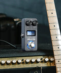 Gig Ready Ultra Lightweight Compact Multi Effects Pedal With SnapTone Tech And IR Loader on amplifier beside guitar neck
