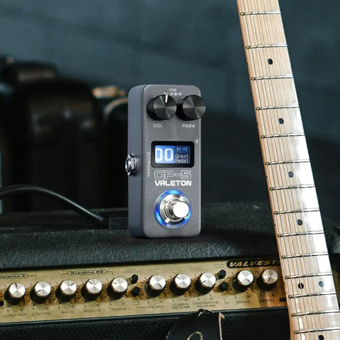 Gig Ready Ultra Lightweight Compact Multi Effects Pedal With SnapTone Tech And IR Loader on amplifier beside guitar neck