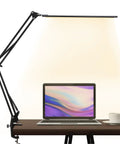 Eye-Care Swing Arm Desk Lamp With No-Fuss Clamp For Home Office illuminating laptop on desk