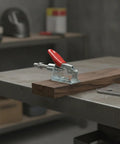 Built Like A Tank Galvanized Steel Toggle Clamp With Bright Red Handle For Welding Fixtures And Woodworking Jigs clamping on wood.