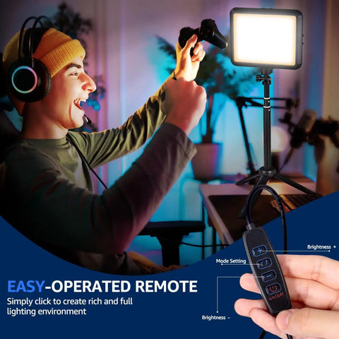 Person gaming with illuminated Two Pack 8 Inch Dope LED Video Lights With 29 Inch Adjustable Tripods, remote control visible
