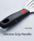 Close-up of 10.3-inch fish spatula with slotted stainless steel blade and black silicone grip handle