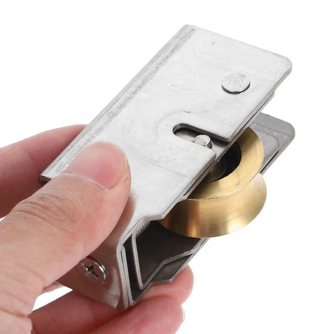 Heavy Duty Sliding Door Roller Replacement Kit With Double Bearings For Whisper Quiet Wardrobe And Patio Glides, metal roller in hand.