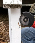 Person using angle grinder with Beefy 50-Pack 4 1/2 Inch Cut Off Wheels For Metal And Stainless Steel, 7/8 Inch Arbor