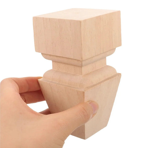 Hand holding a Sturdy Wood Furniture Feet Set for Dresser Cabinet Sofa and Table Legs, easy install durable replacement feet.