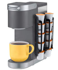 K Cup Holder Organizer For Keurig Pods, Space Saving Countertop Mount, Expandable 5 Per Row Dispenser next to a coffee maker
