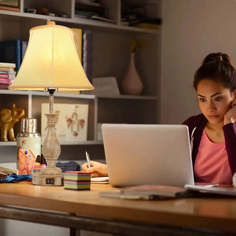 Cozy Farmhouse Table Lamp With Touch Control beside a woman working at a desk, showing linen shade and USB ports in use