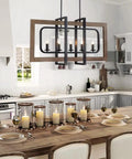 Farmhouse Chandelier Light Fixture With Five Lights In Antique Bronze Oaky Painted Finish above wooden dining table.