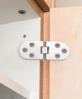 Heavy Duty Folding Table Hinges 4 Pack Stainless Steel Round Edge Brackets Easy Install Hardware For Furniture Build Solid Pivot Zero Drama Assembly Silver Finish Top Shelf Hardware Pick For Weekend Builders showing a close-up of a stainless steel hinge installed on a cabinet.
