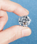 Hand holding a crystal tack from 100 Piece Crystal Upholstery Nails And Tacks Set For Furniture Sofas Headboards And Cork Boards