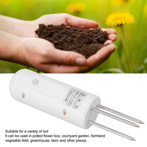 Plant Monitor Soil Test Kit for Indoor Outdoor Gardens, Bluetooth and Zigbee Smart Plant Sensor next to hands with soil