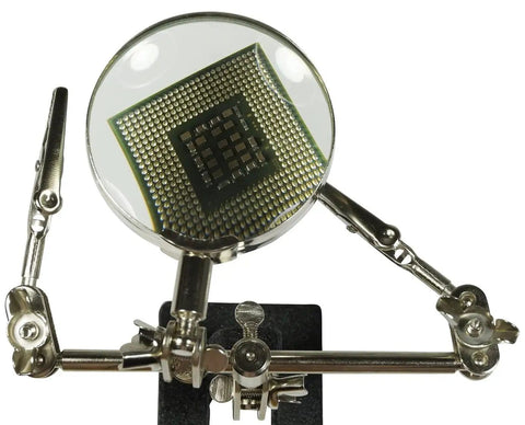 Adjustable Helping Hand With Magnifying Glass 2x, Dual Alligator Clamps holding a PCB on black cast iron base for soldering and repair
