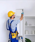 Installer using No Sweat 8X8 White Plastic Access Panel With Door, 6.5 Inch Opening Ideal For HVAC And Plumbing.