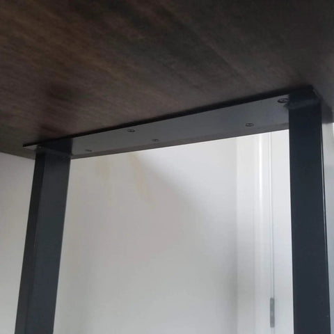 Underside view of a Beefy Industrial Rustic 28 Inch Metal Table Legs Set attached to a wooden tabletop.