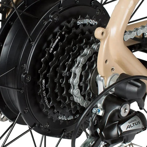 Close-up of 8 Speed Mountain Bike Cassette 12-32 Teeth Black With Hyperglide Compatibility installed on a beige bike