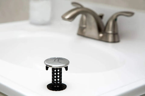 Sick Performance Bathroom Sink Drain Protector Hair Catcher With Universal Sink Stopper in stainless steel on sink.