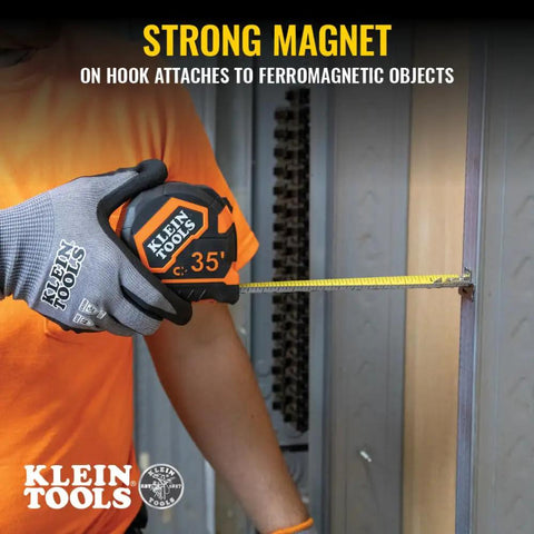 Worker using 9235 Heavy Duty Magnetic Tape Measure With 16 Foot Reach attached to metal surface, showing strong magnet feature.