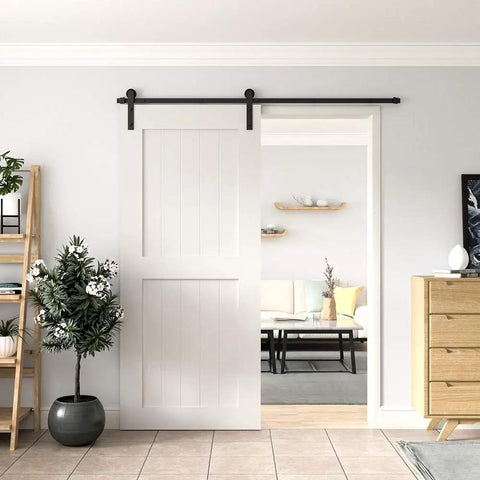 Heavy Duty 6 Foot Sliding Barn Door Hardware Kit For Single Door Featuring Hard Core Black Aluminum Track and installed on white door.