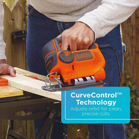 Person using Powerful 5 Amp Corded Jig Saw With 3000 Bpm Blade Speed, Three Quarter Inch Orbital Action, and CurveControl on wood.