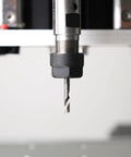 Close-up of one eighth inch shank CNC router bit set four in one with two flute ball nose in spindle for engraving
