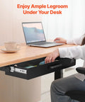 Heavy Duty Under Desk Drawer Slide Out Smooth Glide Hidden Counter Storage For Office And Home Sit Stand Workstation Slick Black Metal Zero Hassle Install in use under a desk with a person reaching for items.