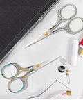 Two-piece set of small embroidery scissors with iridescent rainbow and silver handles, stainless steel blades