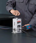 Heavy Duty Wire Stripper Machine with hand crank or drill powered modes in use, stripping copper cable, ideal for small workshops